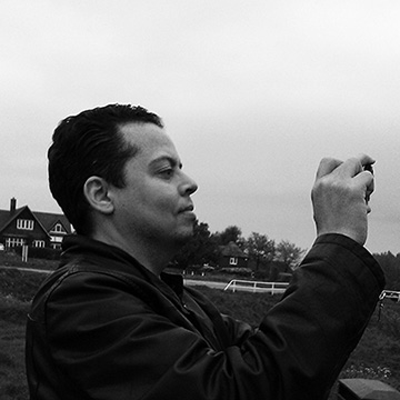 dean murray in black and white taking photograph