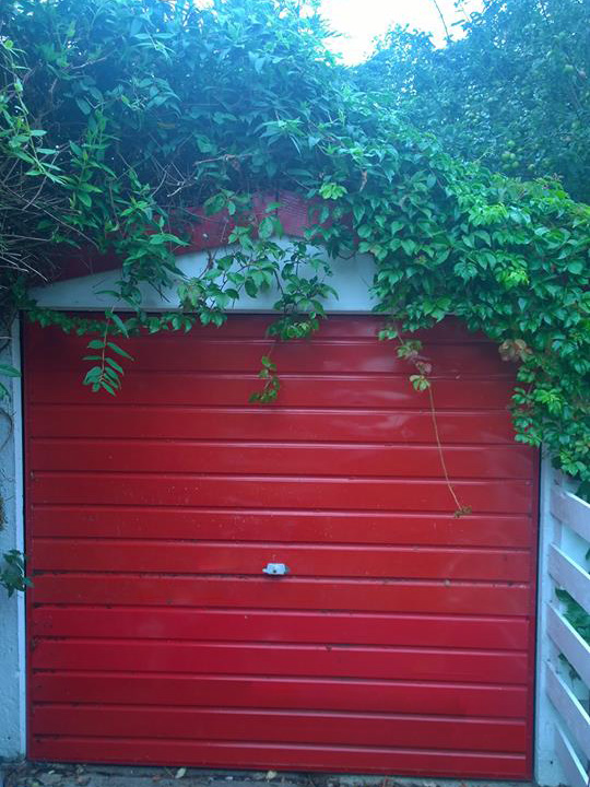 garage door wrapped in red vinyl